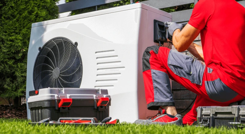 a technician doing swiming pool heat pump maintenance