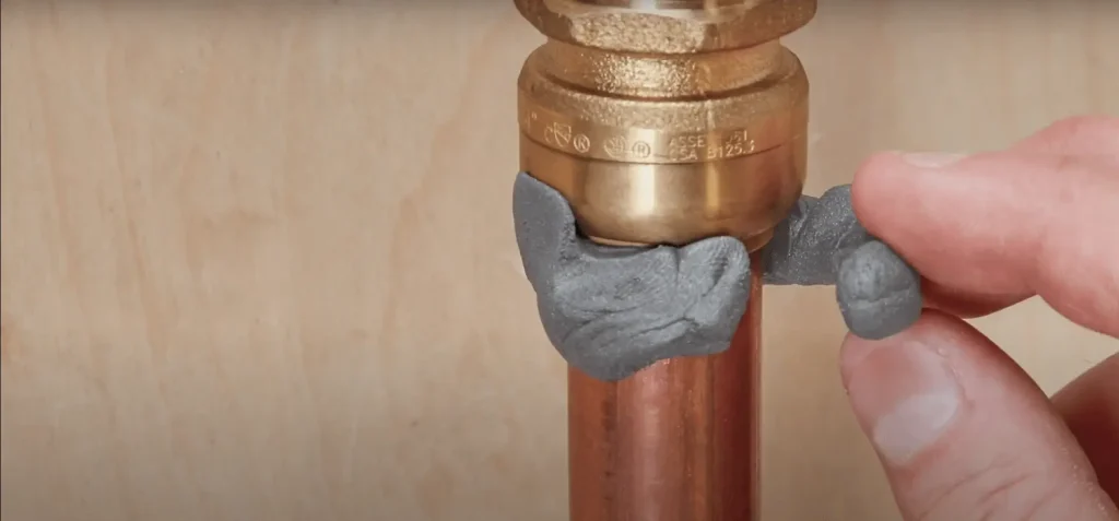 sealing the crack with an epoxy putty