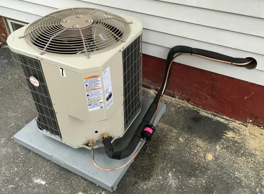 Condenser unit with refrigerant lines connected to an indoor air handler for cooling