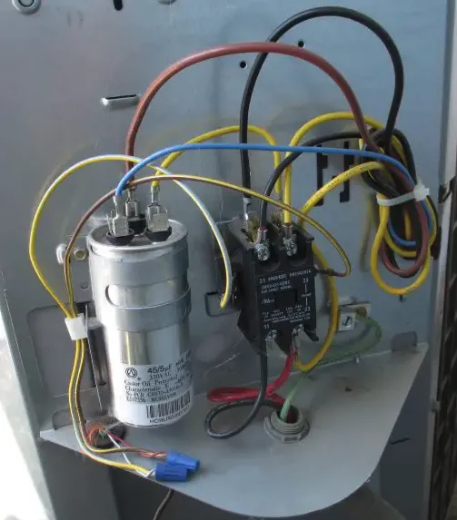 You need to discharge your air conditioner capacitor before testing it