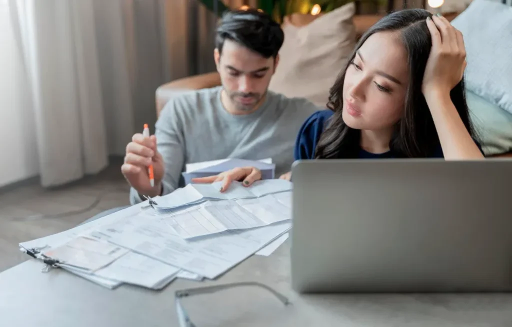 A couple stressed over utility bills from an inefficient AC