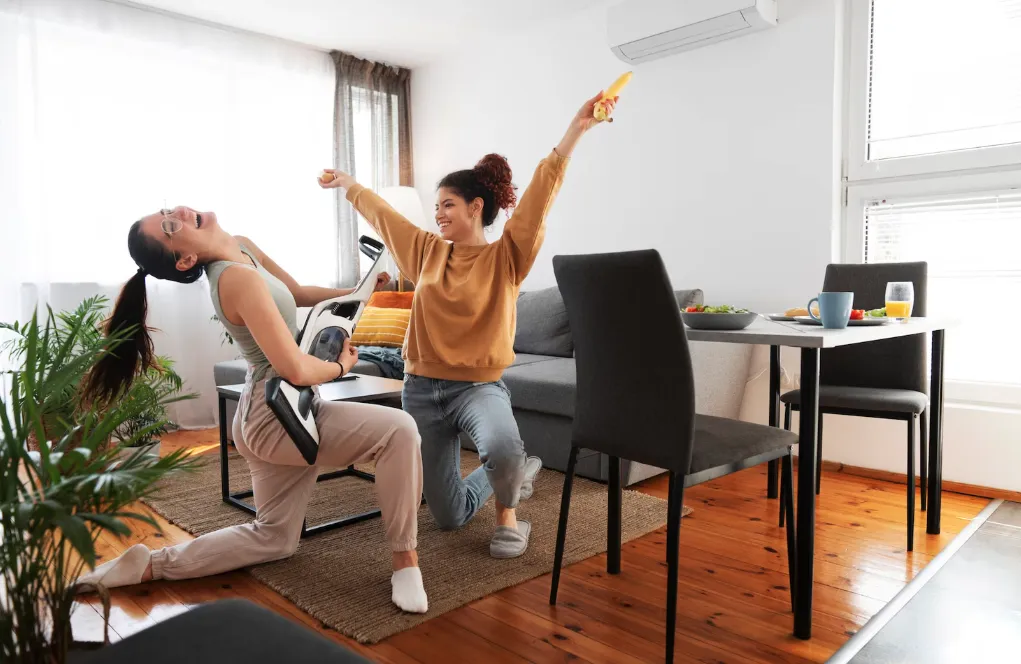 A joyful scene in a modern living room with wall AC