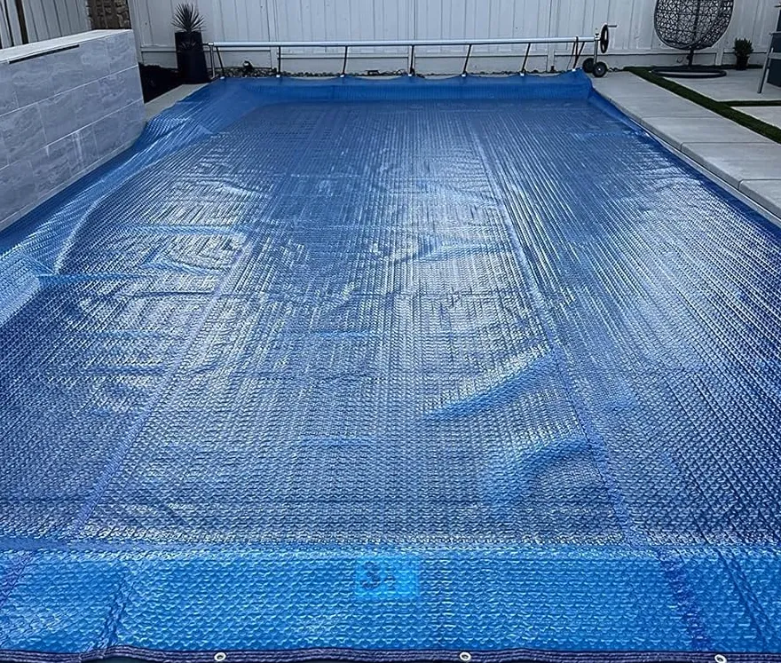 how to heat a pool and stop heat loss_ Use a bubble solar blanket to cover your pool