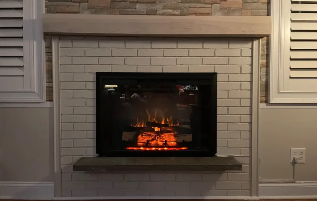 Cozy electric fireplace with brick and stone surround