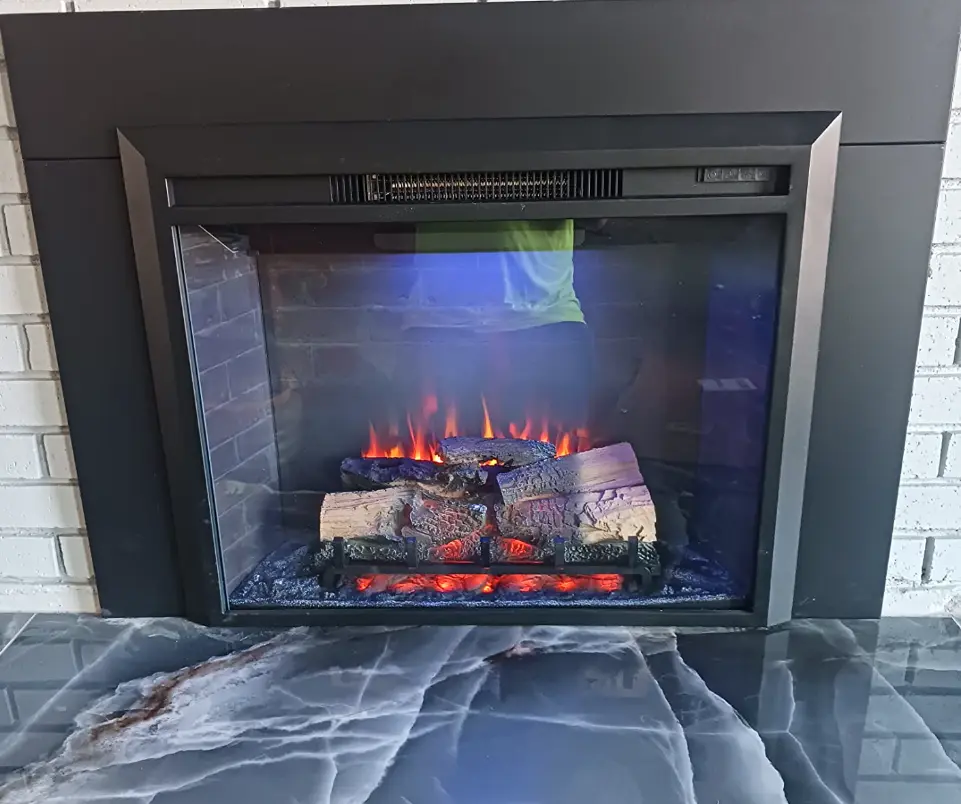 Modern electric fireplace with glowing logs and flames