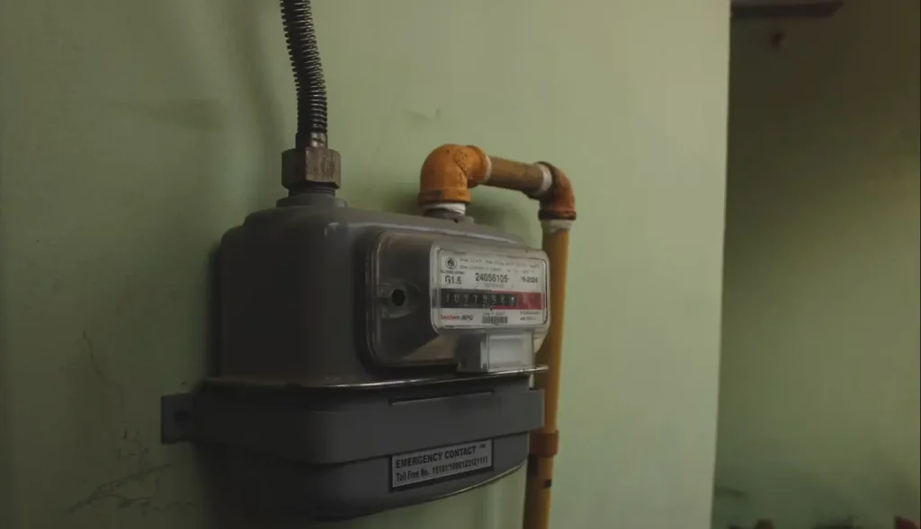 Gas meter on green wall which decide if you can have a gas fireplace