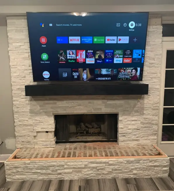 Make it proportional when you add a TV above a fireplace