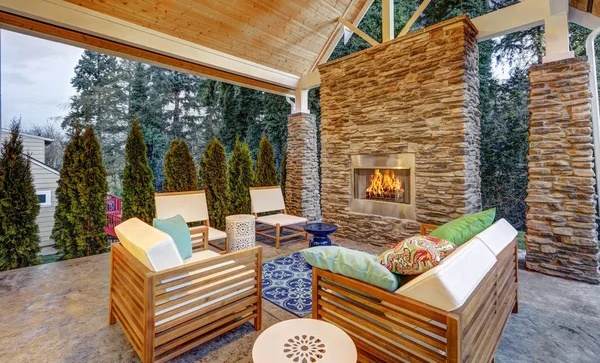 A patio with built in gas fireplace